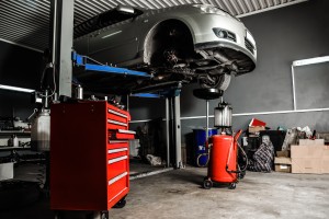 Auto on lift being inspected in Walnut Creek, CA